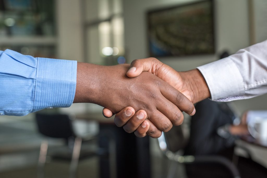 Black and White shaking hands